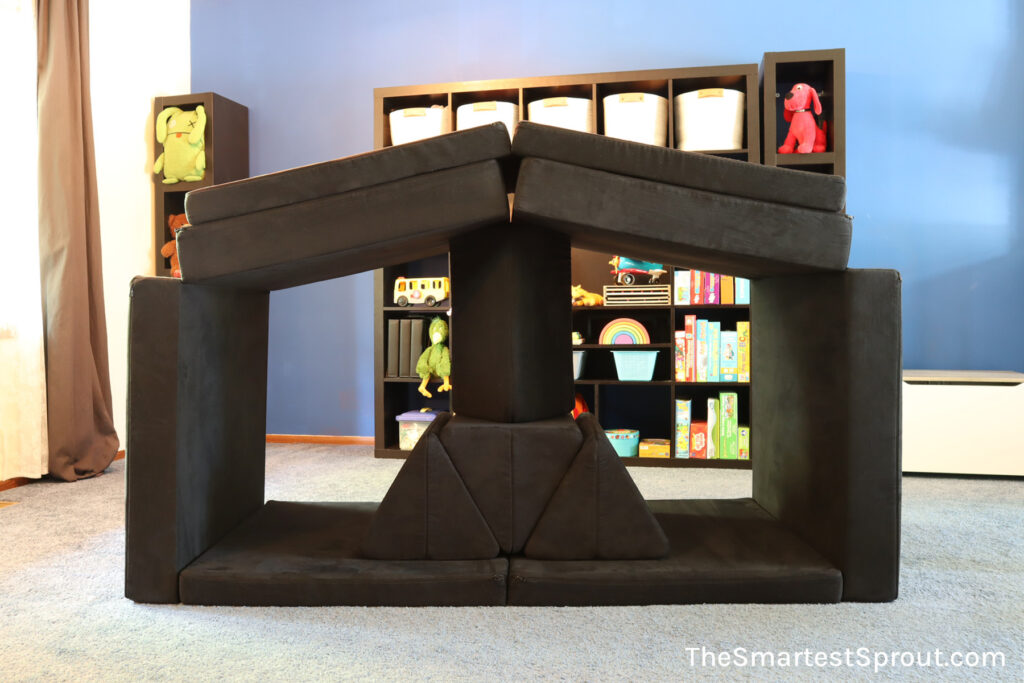 Camp Crazy nugget fort built with two Nugget play couches creating an open structure for active indoor play
