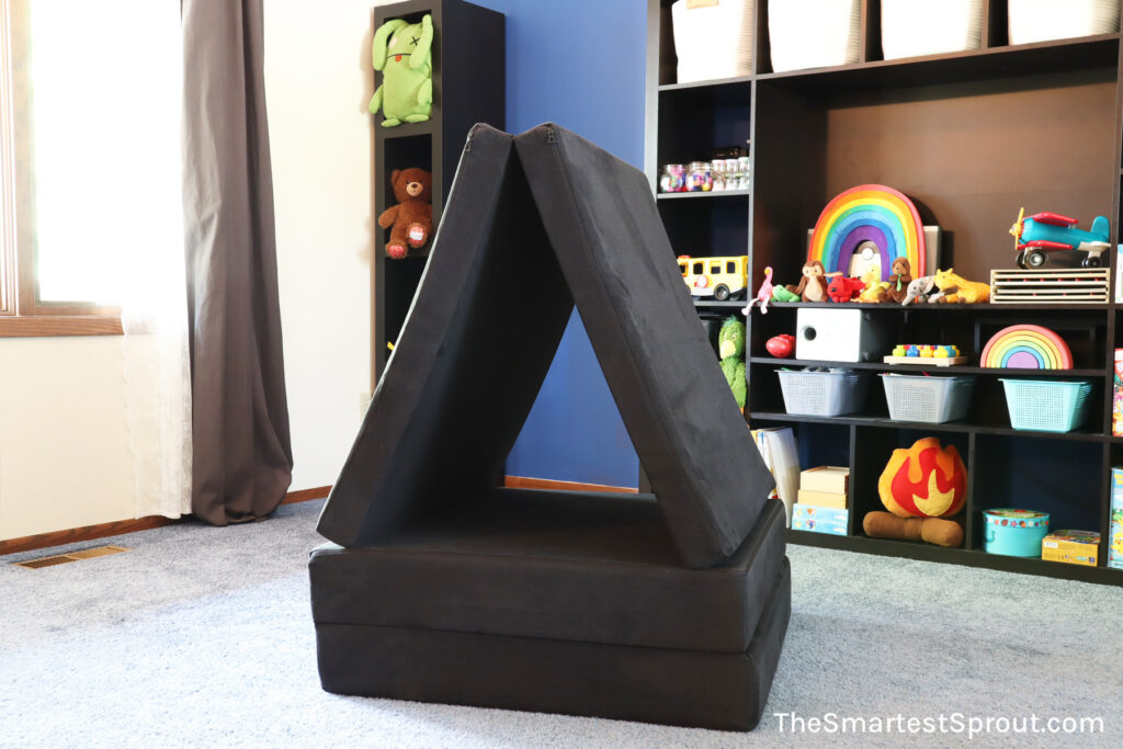 Mindfulness Mountain nugget fort built with one Nugget play couch creating a simple climbing structure for quiet indoor play