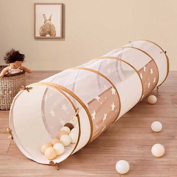 Pop-up play tunnel for toddlers used as a Nugget couch accessory for crawling and imaginative play