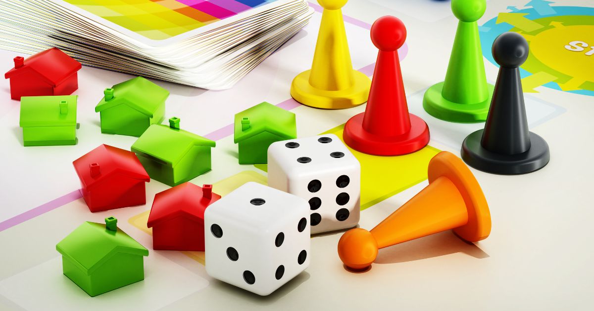 Colorful Christian family board game pieces including dice, pawns, and houses on a game board for kids game night
