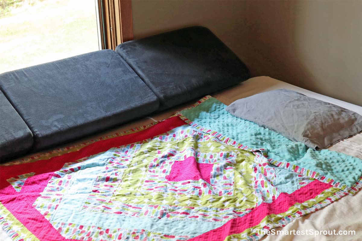 Nugget couch cushions used to fill the gap between mattress and wall